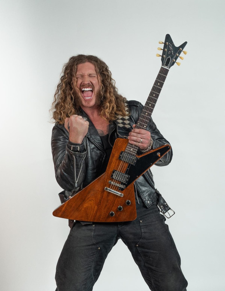 Jared James Nichols holding his mahogany Gibson Futura